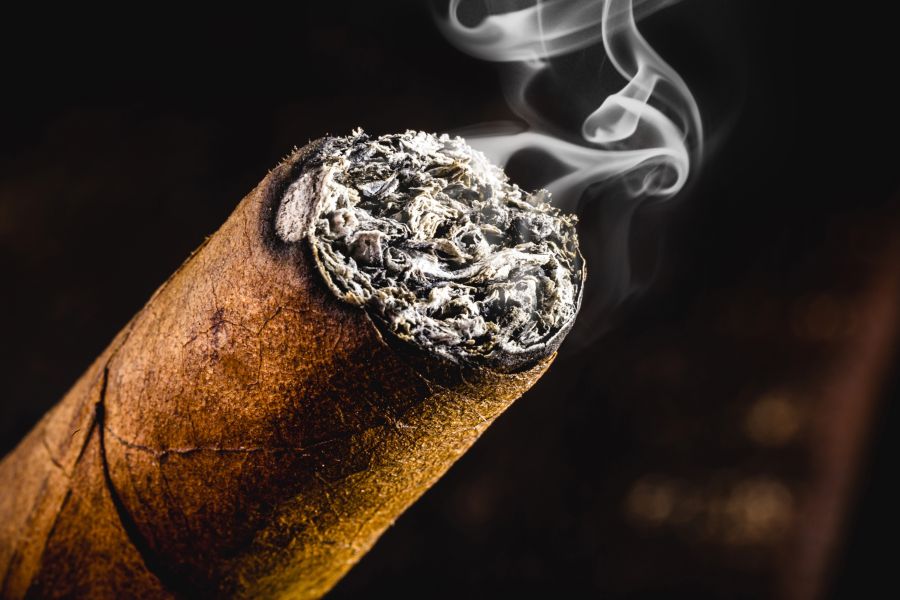 stock-photo-detail-of-cigar-tip-giving-off-smoke-macro-photo-smoking-concept-1862622625