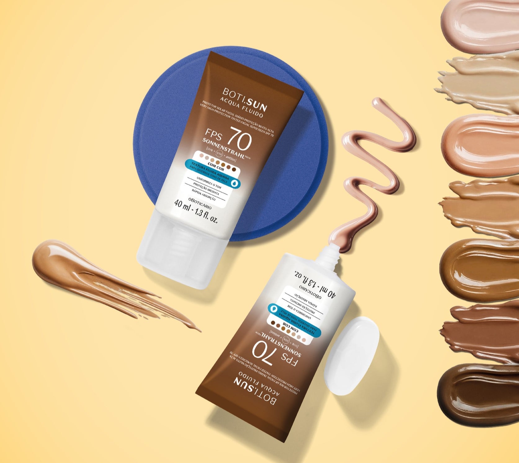 A imagem mostra dois tubos do protetor solar Boti.Sun FPS 70 sobre um fundo amarelo, com amostras de várias tonalidades espalhadas ao redor, destacando a variedade de cores da linha.